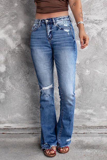 Jeans svasati a vita alta con orlo grezzo strappato blu scuro