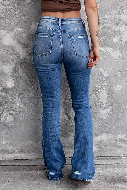 Jeans svasati a vita alta con orlo grezzo strappato blu scuro